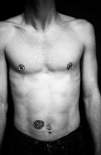 male with nipple piercing